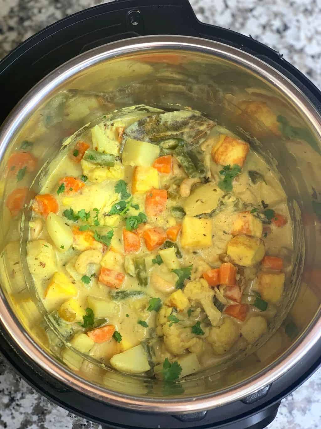 navratan kurma in instant pot insert garnished with cilantro