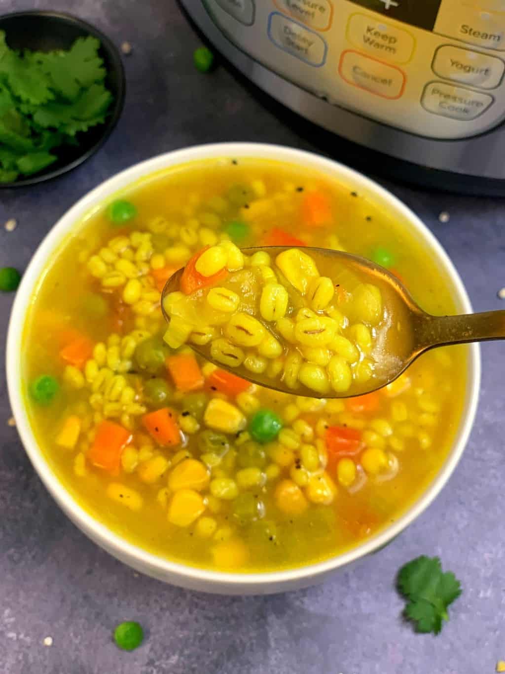pressure cooker pearl barley soup served in a spoon
