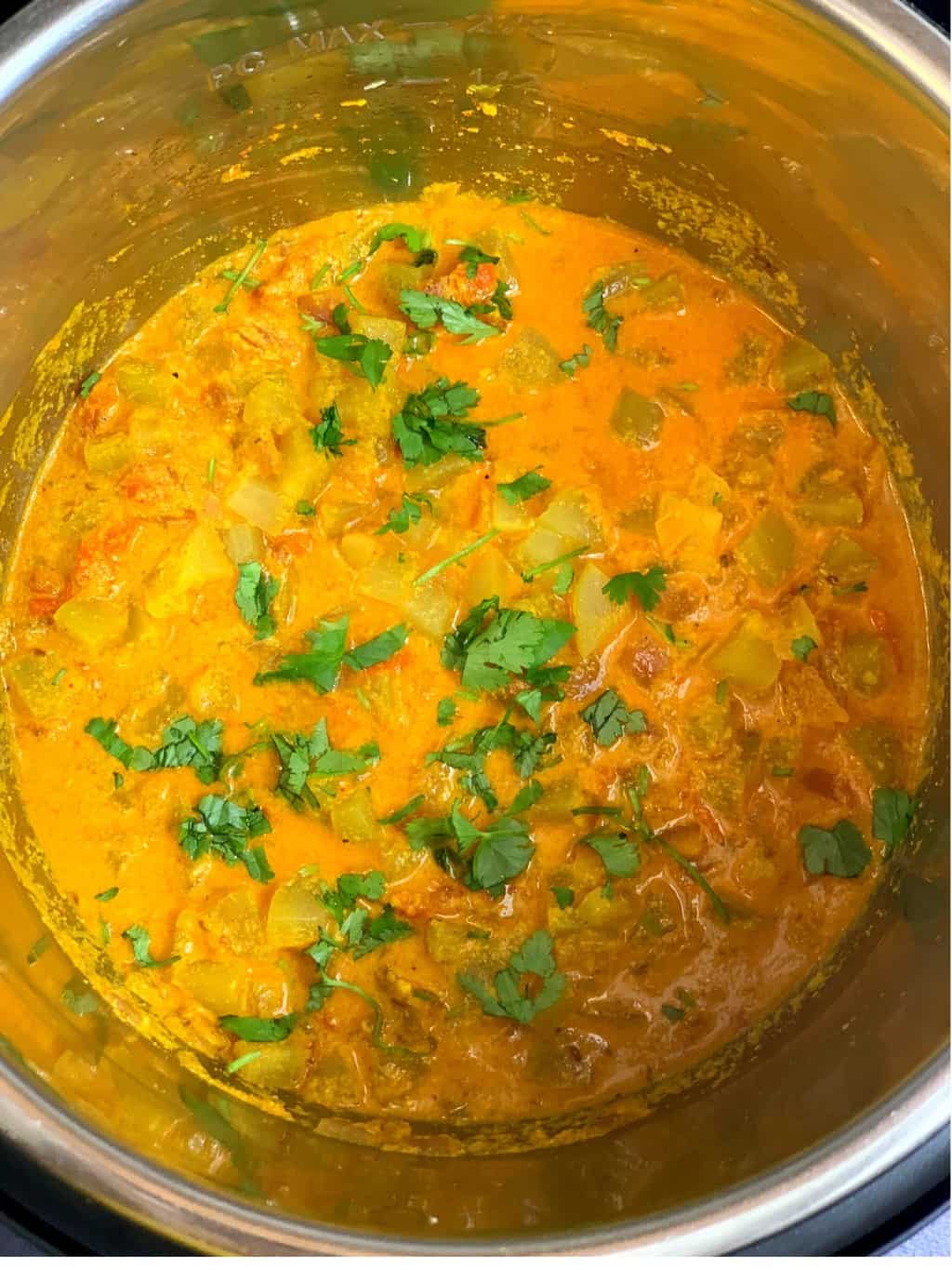 bottle gourd curry in instant pot insert garnished with cilantro