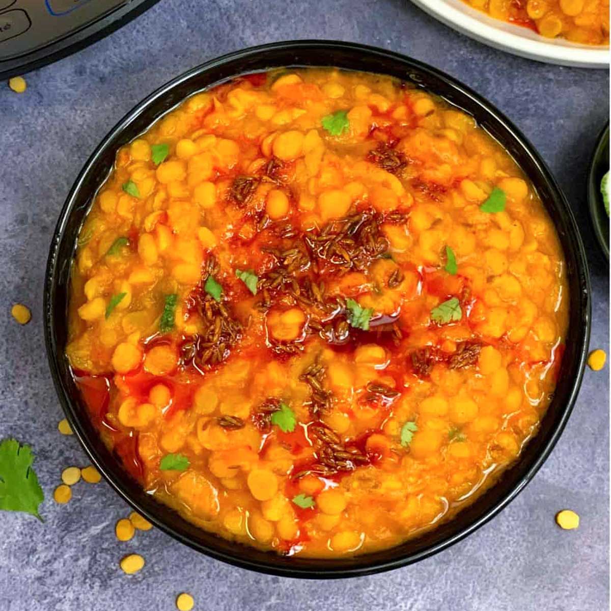 instant pot chana dal served in a black bowl