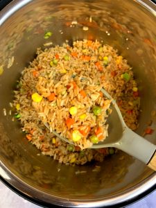 vegetable fried rice in a silicon spoon