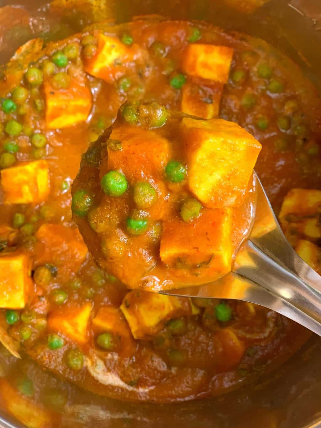 mutter paneer in a spoon