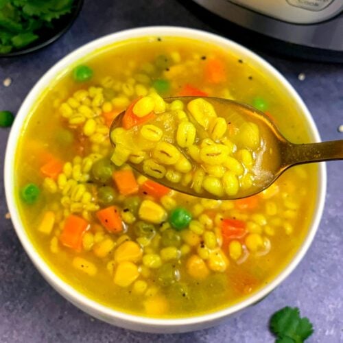 Vegetable and Pearl Barley Soup served in a white bowl