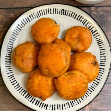 Zucchini Bajji served in a plate with tomato ketchup on the side