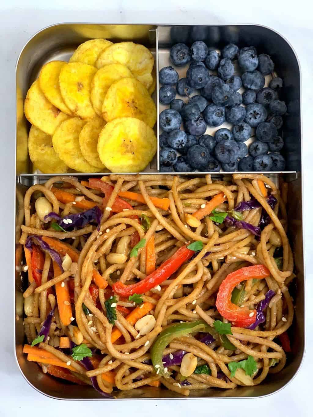 Thai Peanut Noodles, Blueberries, Banana Chips in bento steel lunch box.