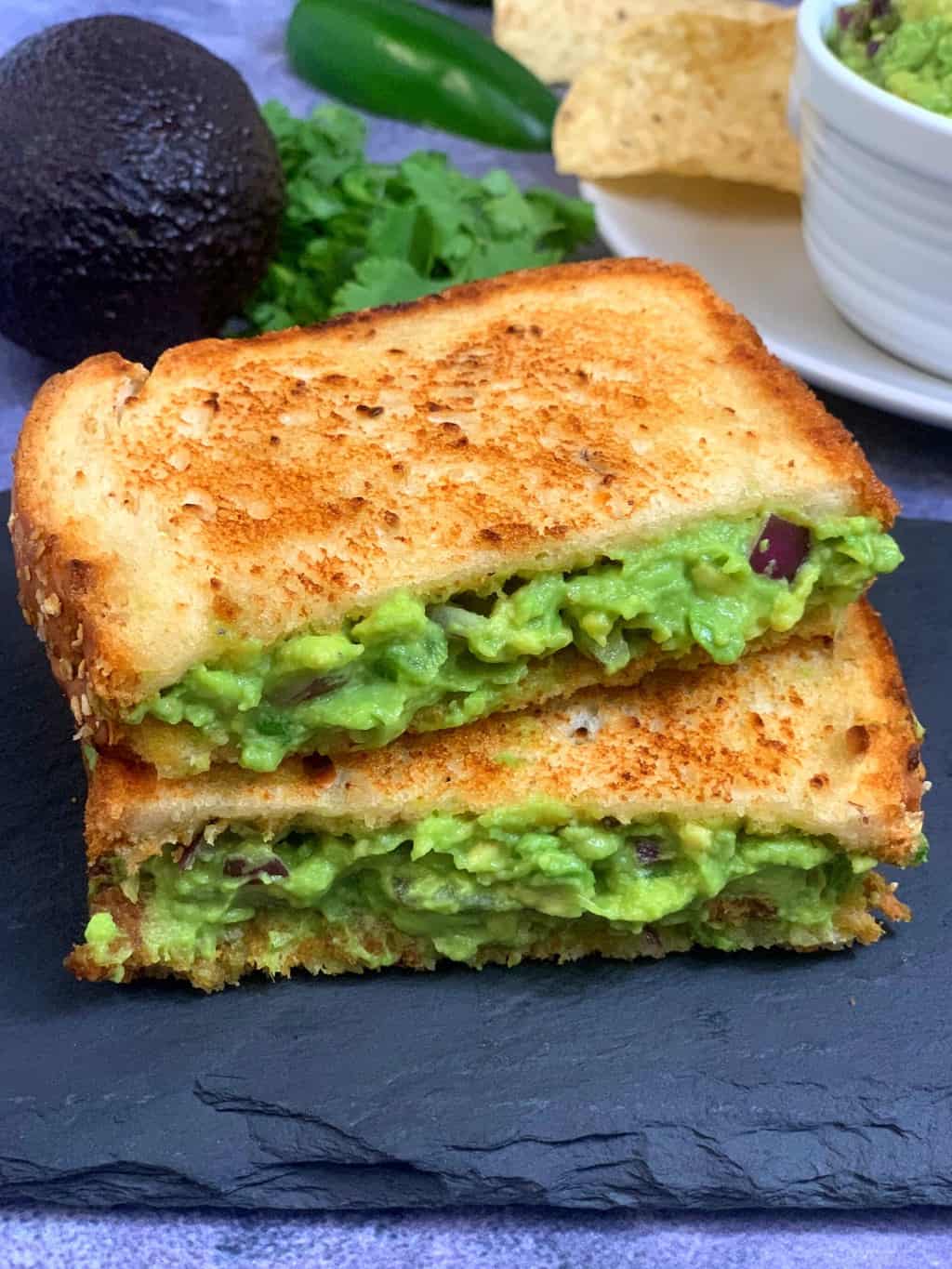 grilled Guacamole sandwich served on black slate