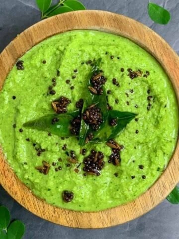 Moringa leaves Coconut Chutney served in a bowl with tempering on the top