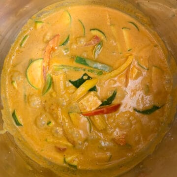 thai red curry is boiling in the instant pot