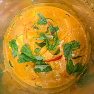 thai basil and lemon juice added to thai red curry