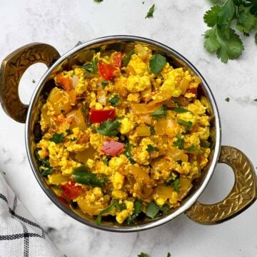 Indian Style Tofu bhurji/scramble served in a kadai garnished with cilantro