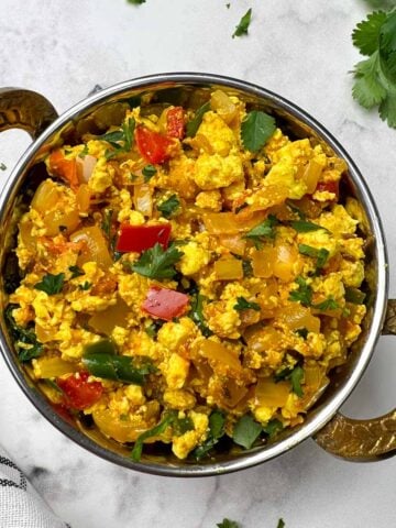 Indian Style Tofu bhurji/scramble served in a kadai garnished with cilantro