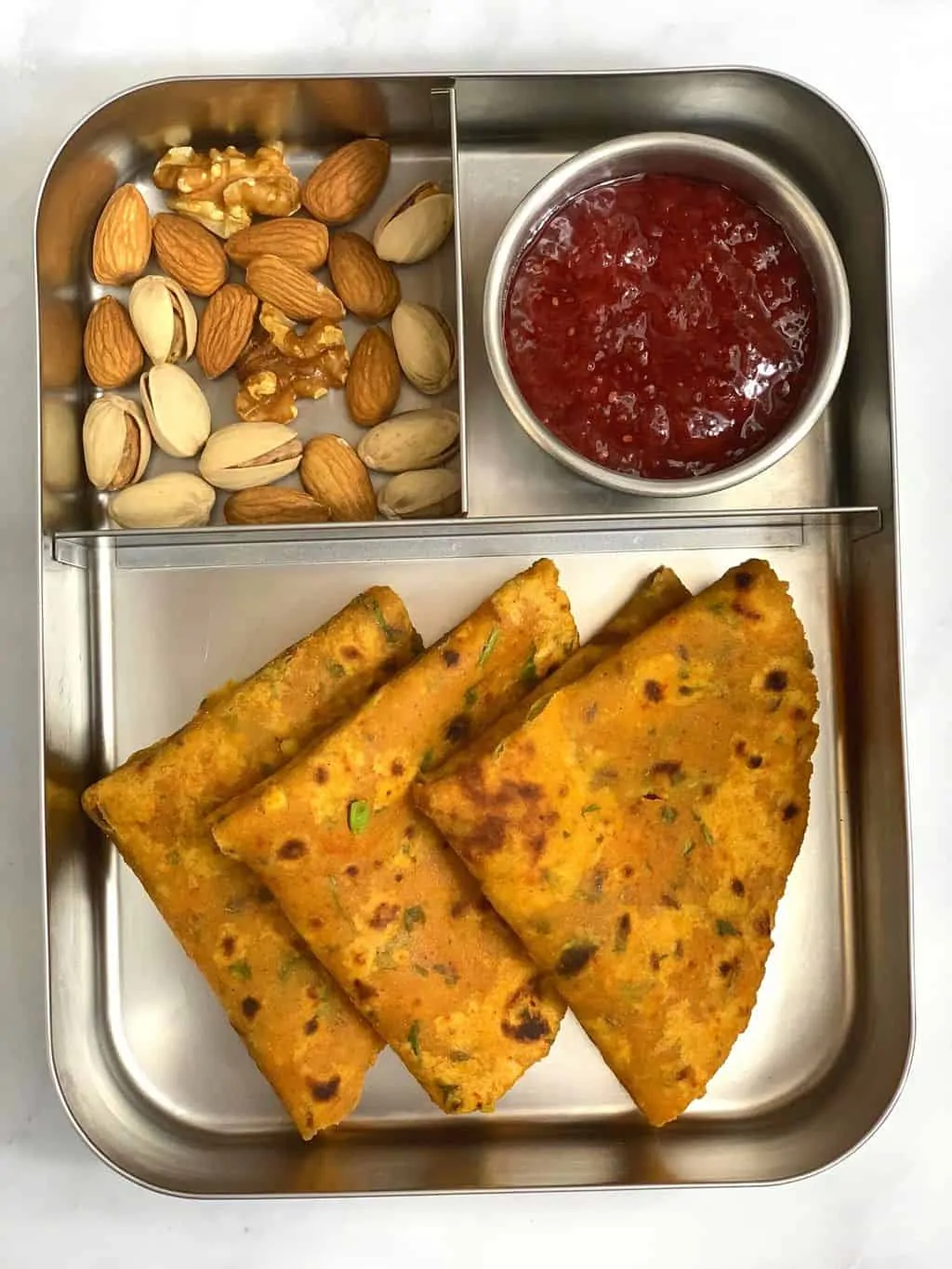 tofu paratha in kids lunch box with nuts and chia jam