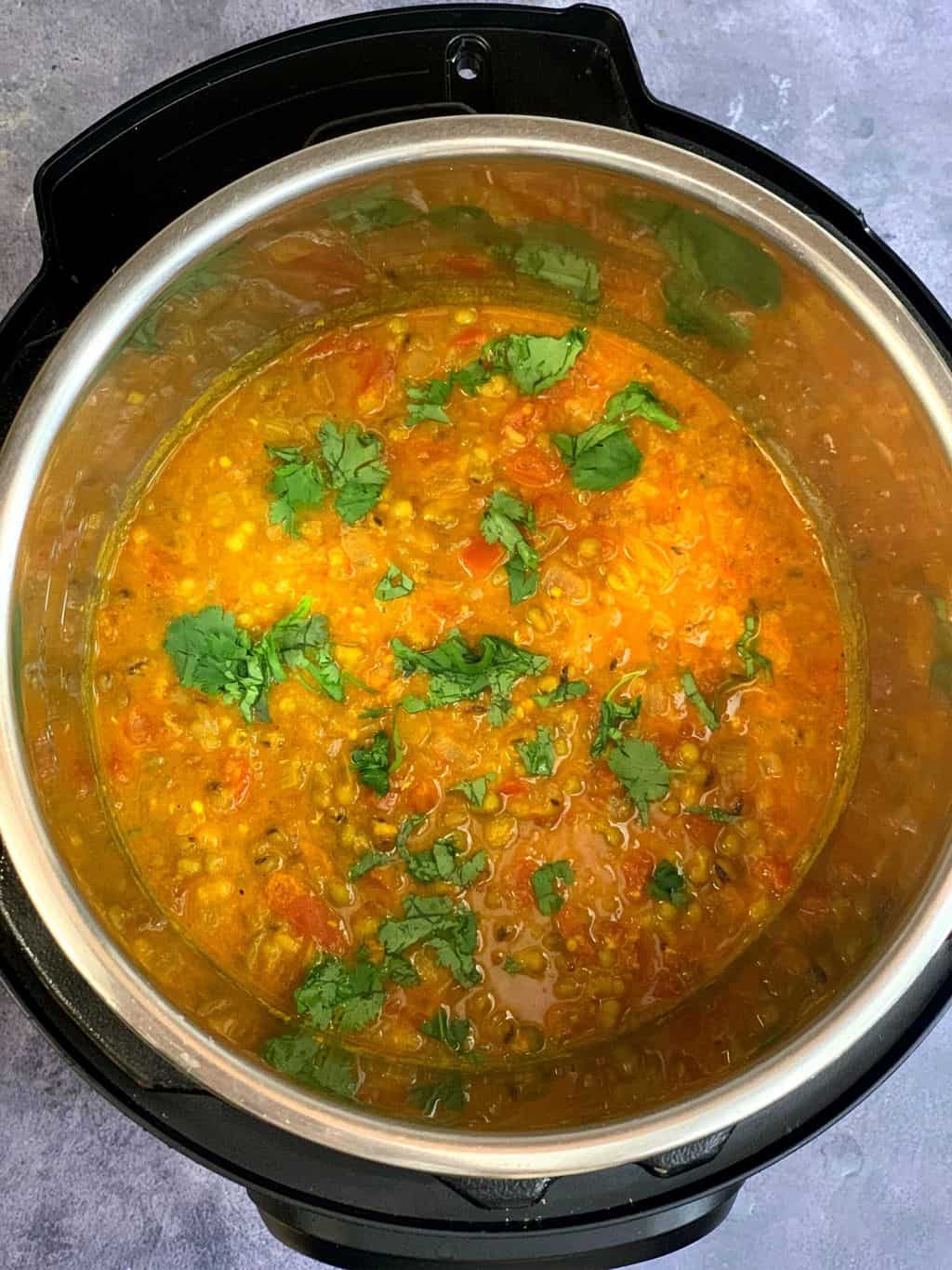 Mung Bean Curry in instant pot insert garnished with cilantro