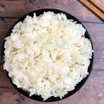 instant pot cooked jasmine rice served in a bowl with chopsticks on the side