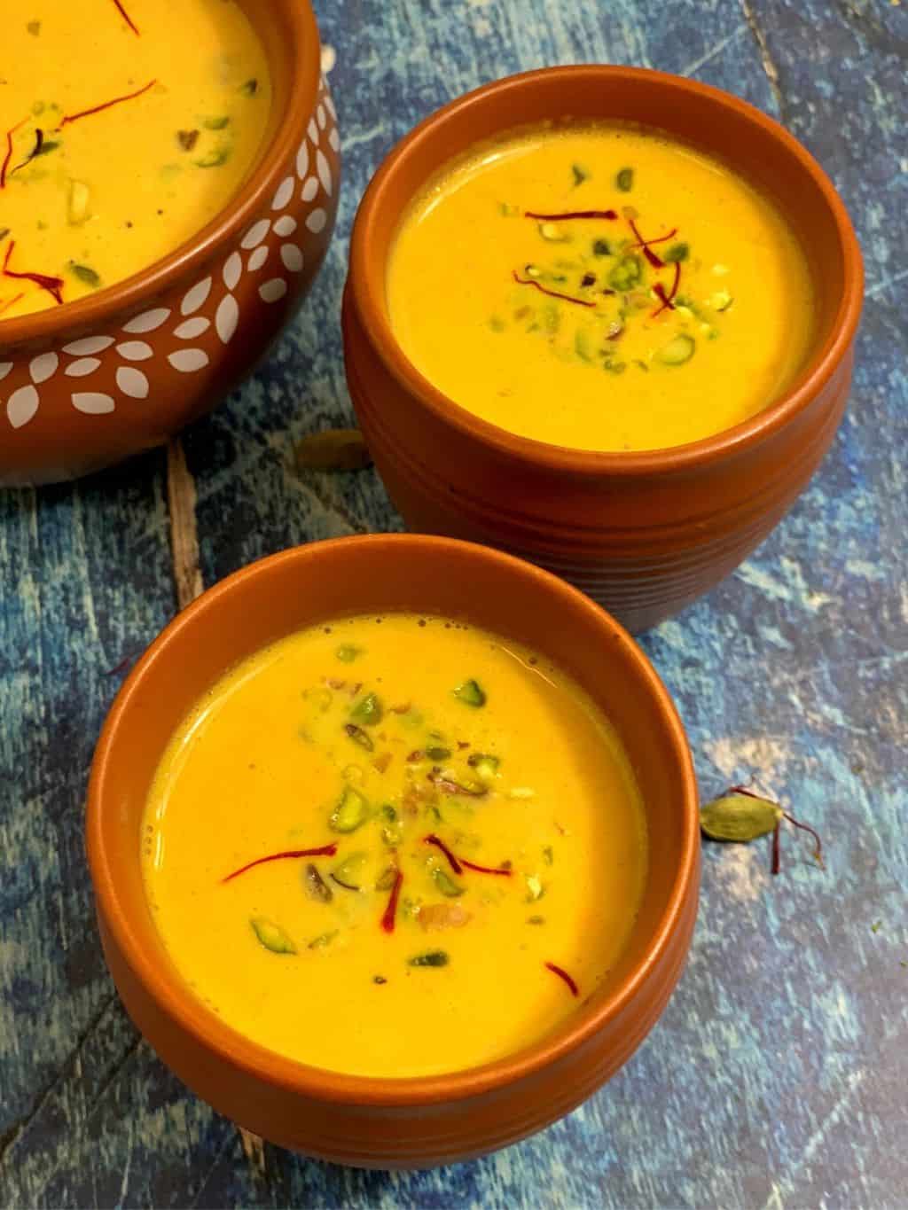 instant pot carrot almond kheer/payasam served in a serving bowl garnished with pistachios
