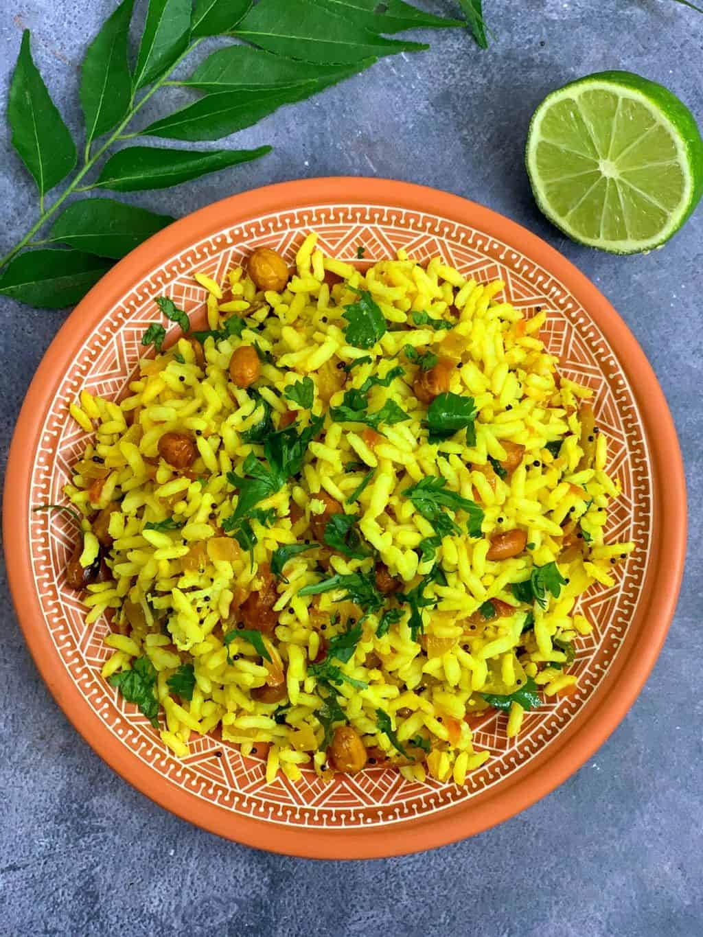 mandakki usali/susla/puffed rice upma served in a brown plate and lemon on side