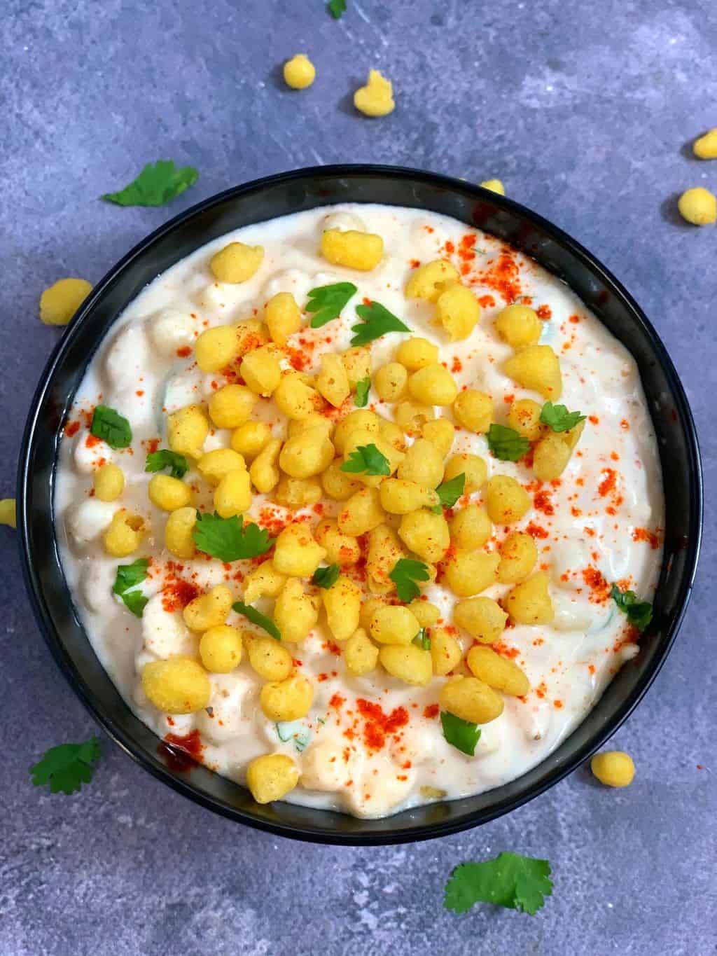 boondi raita served in a black bowl