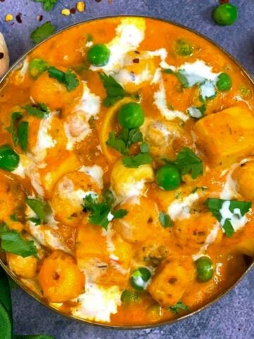 Paneer Matar Makhana Curry served in a copper bottom bowl