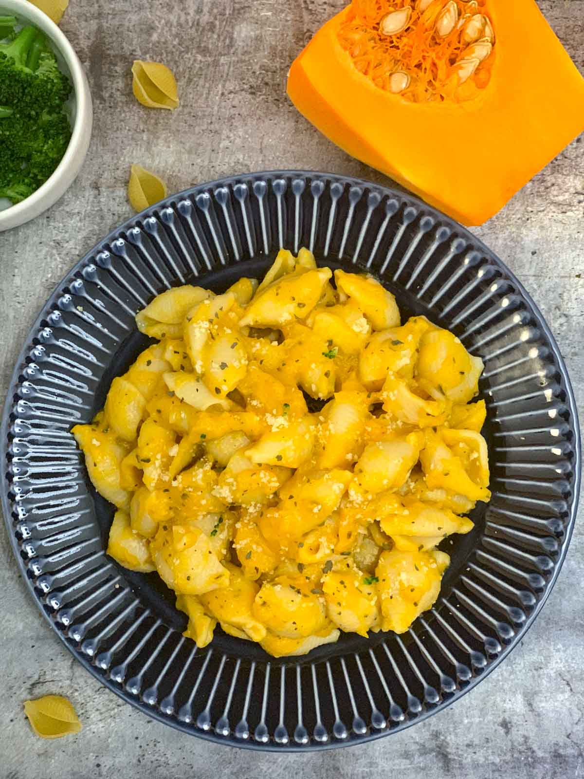 butternut squash pasta served on a plate with squash on side