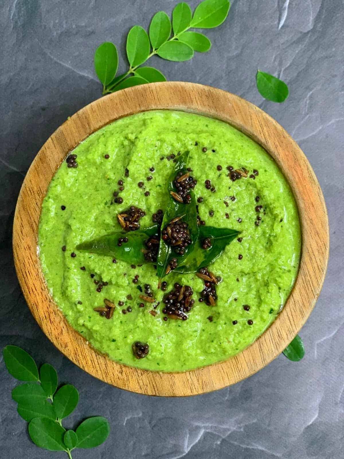 Moringa leaves Coconut Chutney served in a bowl with tempering on top