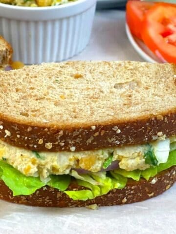 chickpea salad sandwich served with veggies on the side