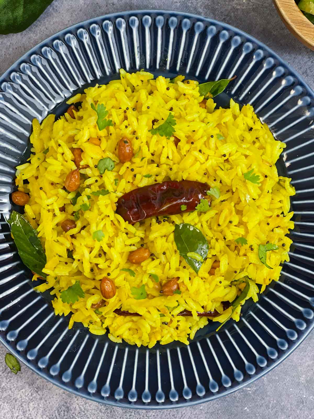 raw mango rice (mavinakayo chitranna recipe) served in a plate