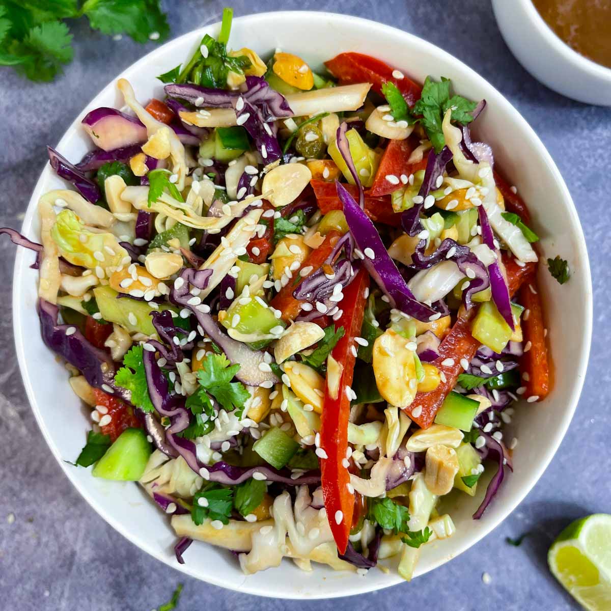 crunchy thai peanut salad served in a bowl