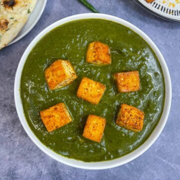 palak tofu served in a bowl topped with fried tofu