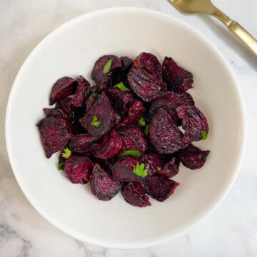 air fried beetroot in a bowl garnished with coriander