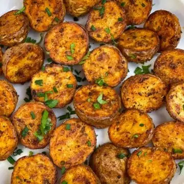 air fryer roasted bay potatoes serve don a plate garnished with parsley