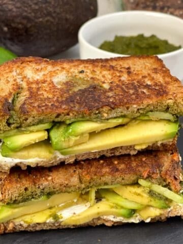 grilled avocado chutney sandwich placed one above the other
