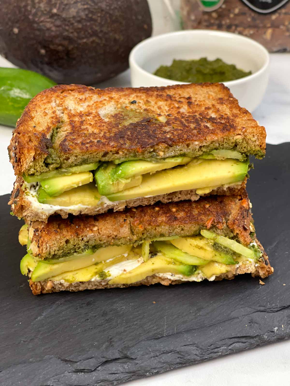 grilled avocado chutney sandwich placed one above the other