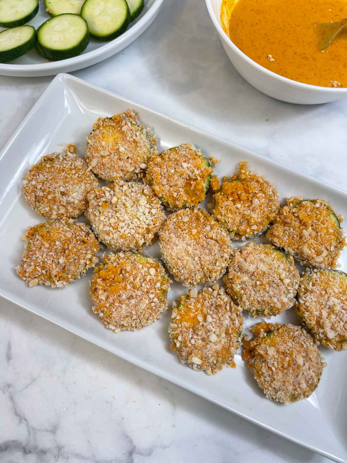 breaded zucchini chips on a tray