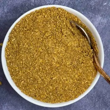 coriander powder in a bowl with a spoon