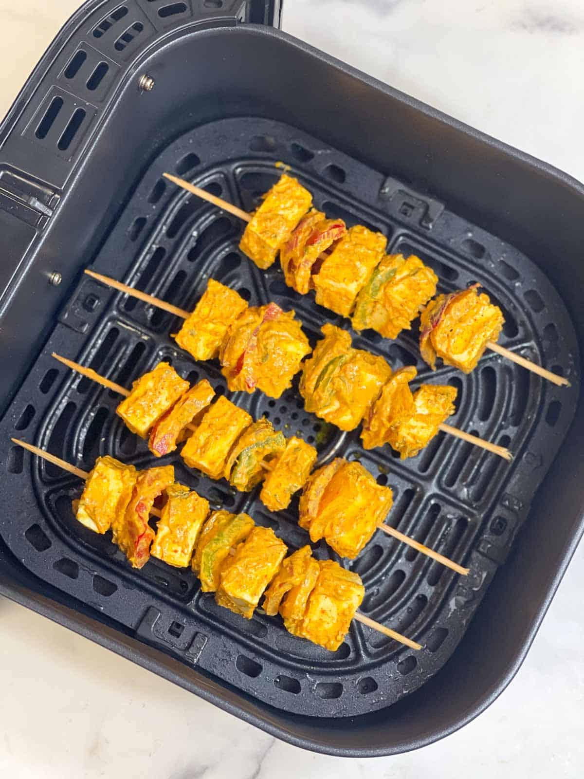 step to arrange the skewers in the basket