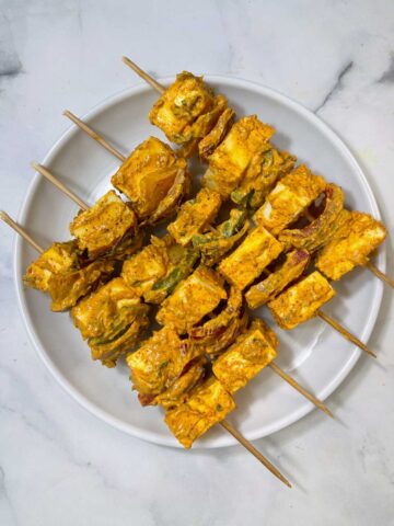 paneer tikka lined on a plate