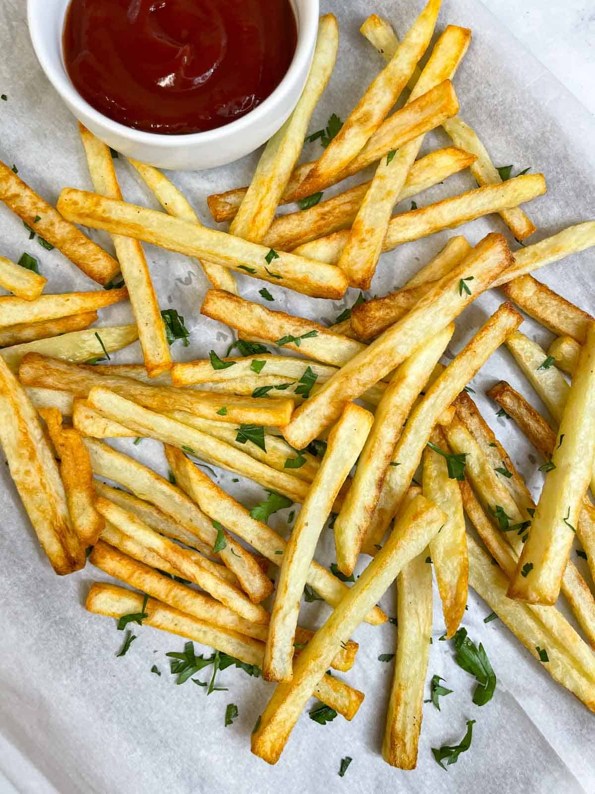 homemade french fries served with ketchup