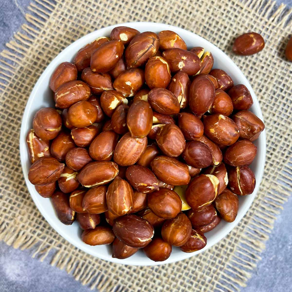 air fryer roasted peanuts served in a white bowl