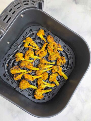 air fryer tandoori broccoli tikka in air fryer basket