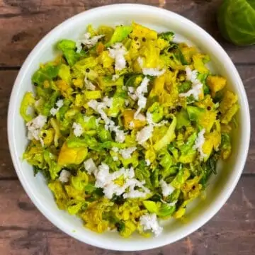 brussels sprouts poriyal served on a bowl
