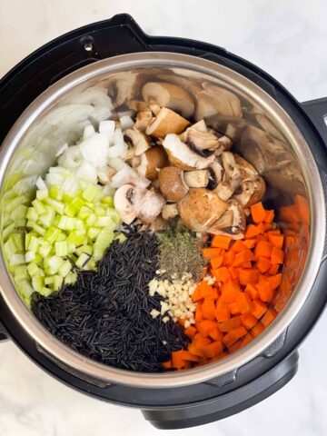 step to add soup ingredients to the pot