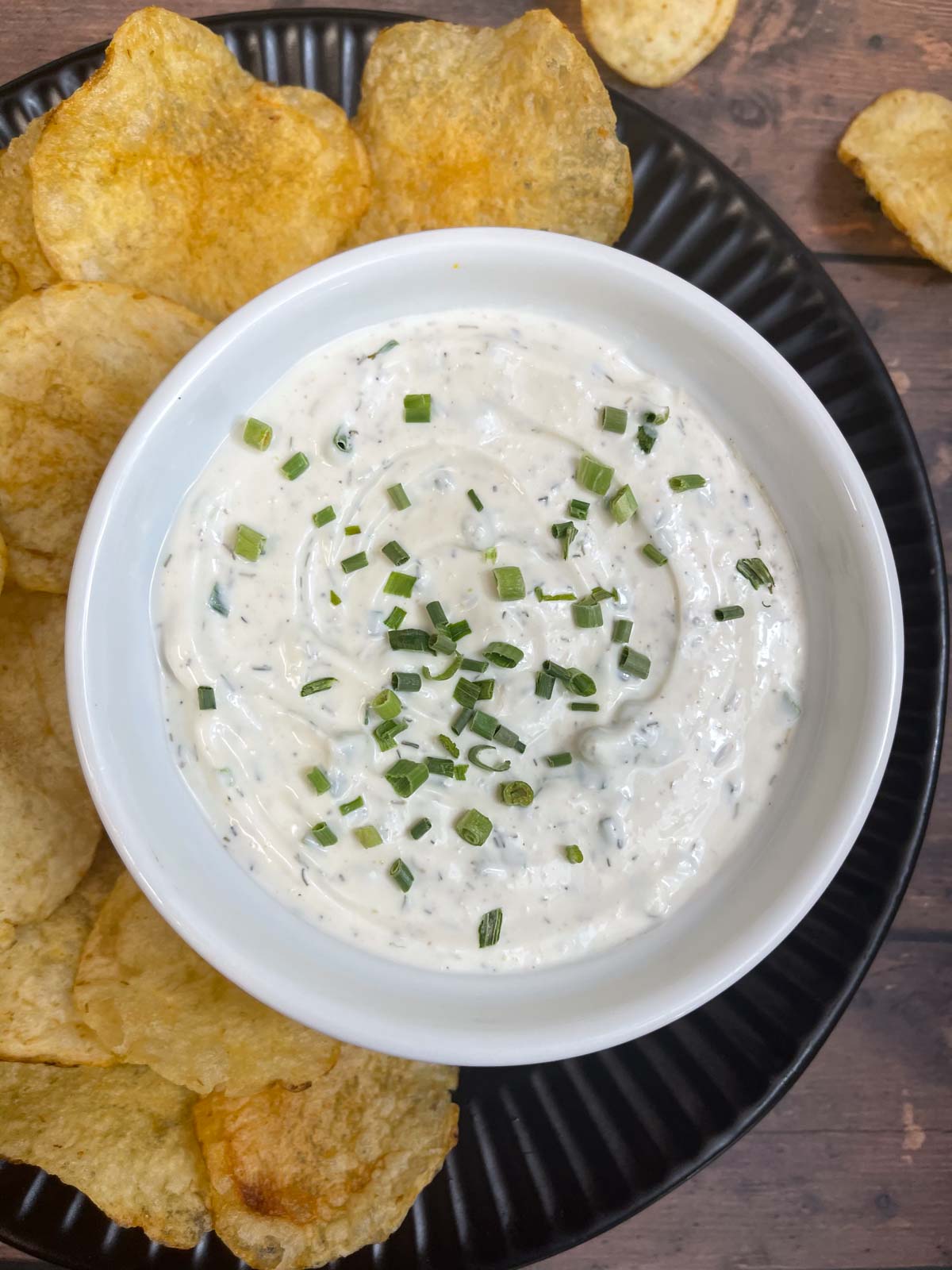 sour cream dip served in a bowl with chips