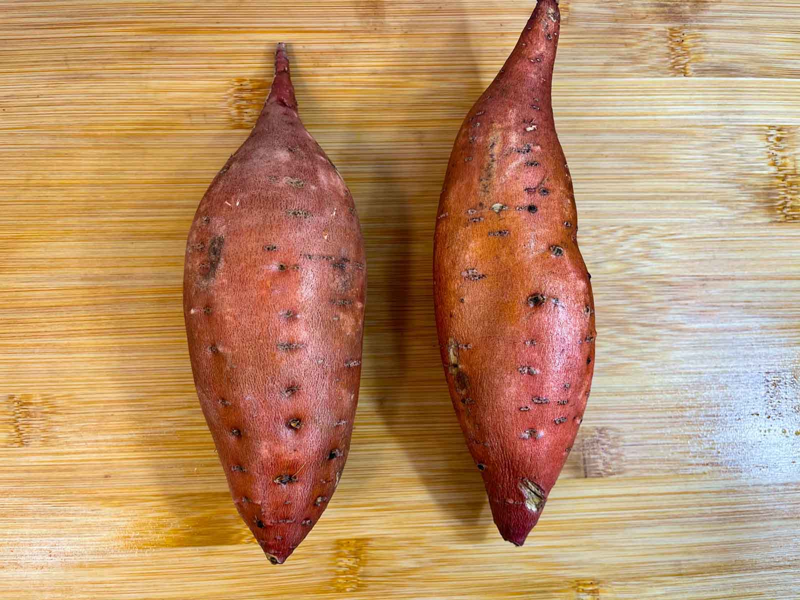 sweet potatoes on a cutting board