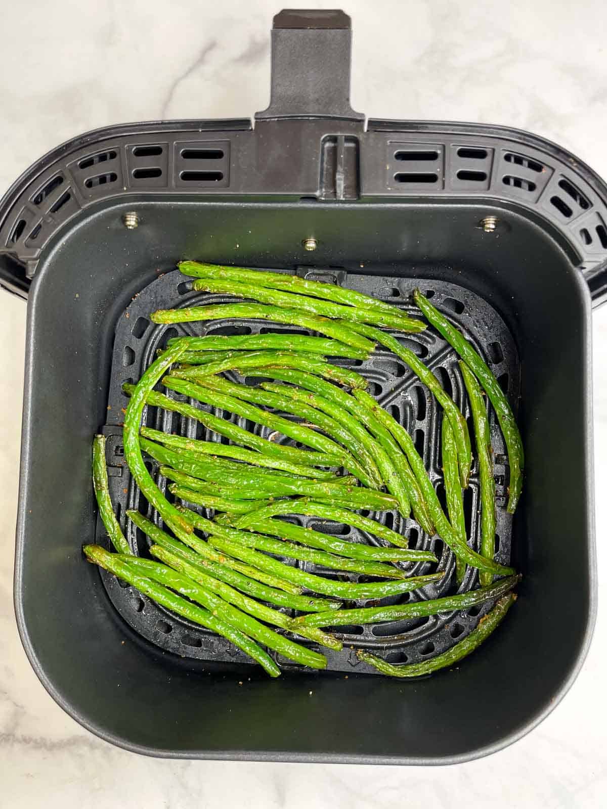 air fried green beans in the air fryer basket