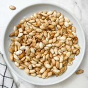 roasted pumpkin seeds served on a plate