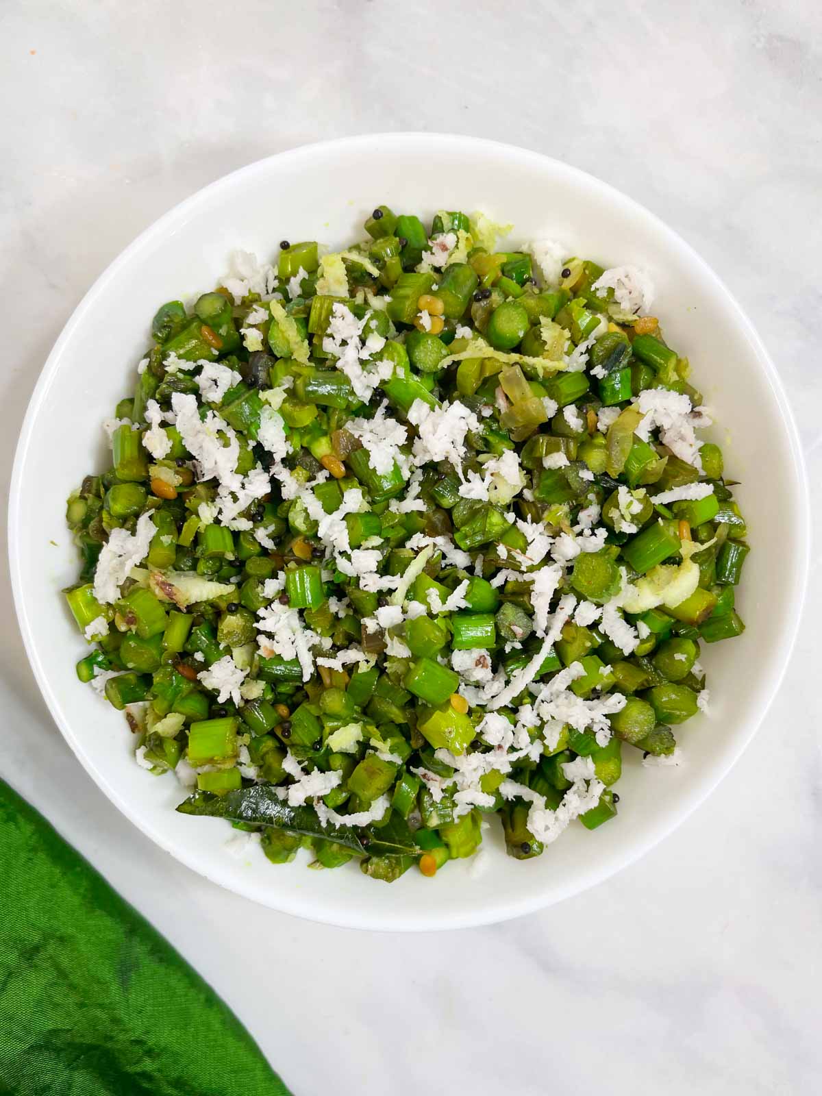 asparagus poriyal (Asparagus Stir Fry with coconut) served on a bowl