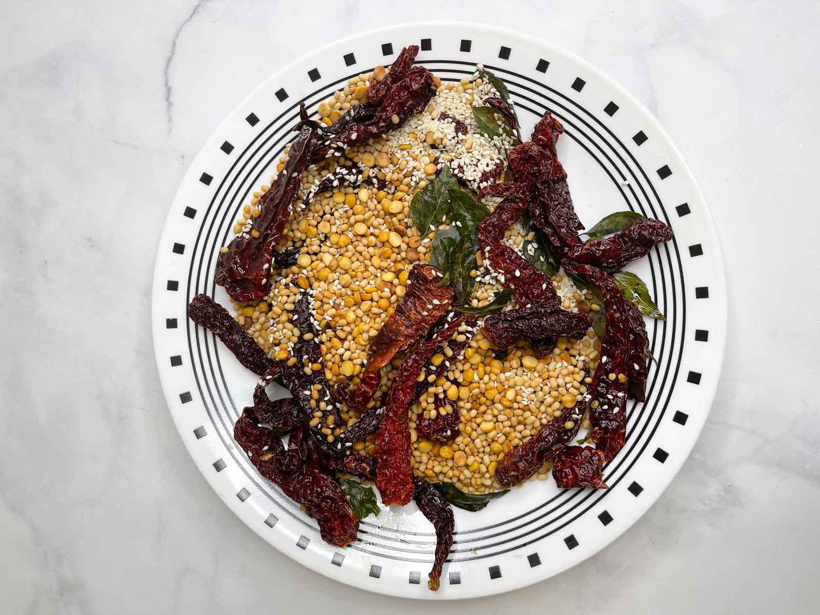 roasted ingredients for gun powder chutney powder in a plate