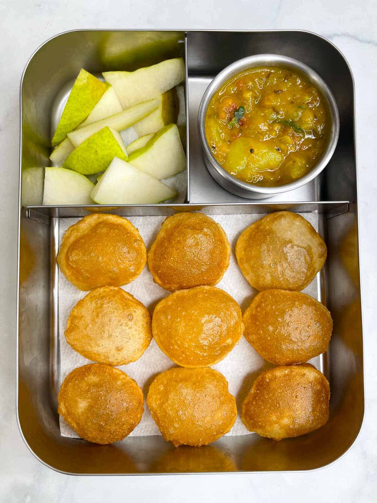 mini poori with potato sagu and pears in bento steel lunch box