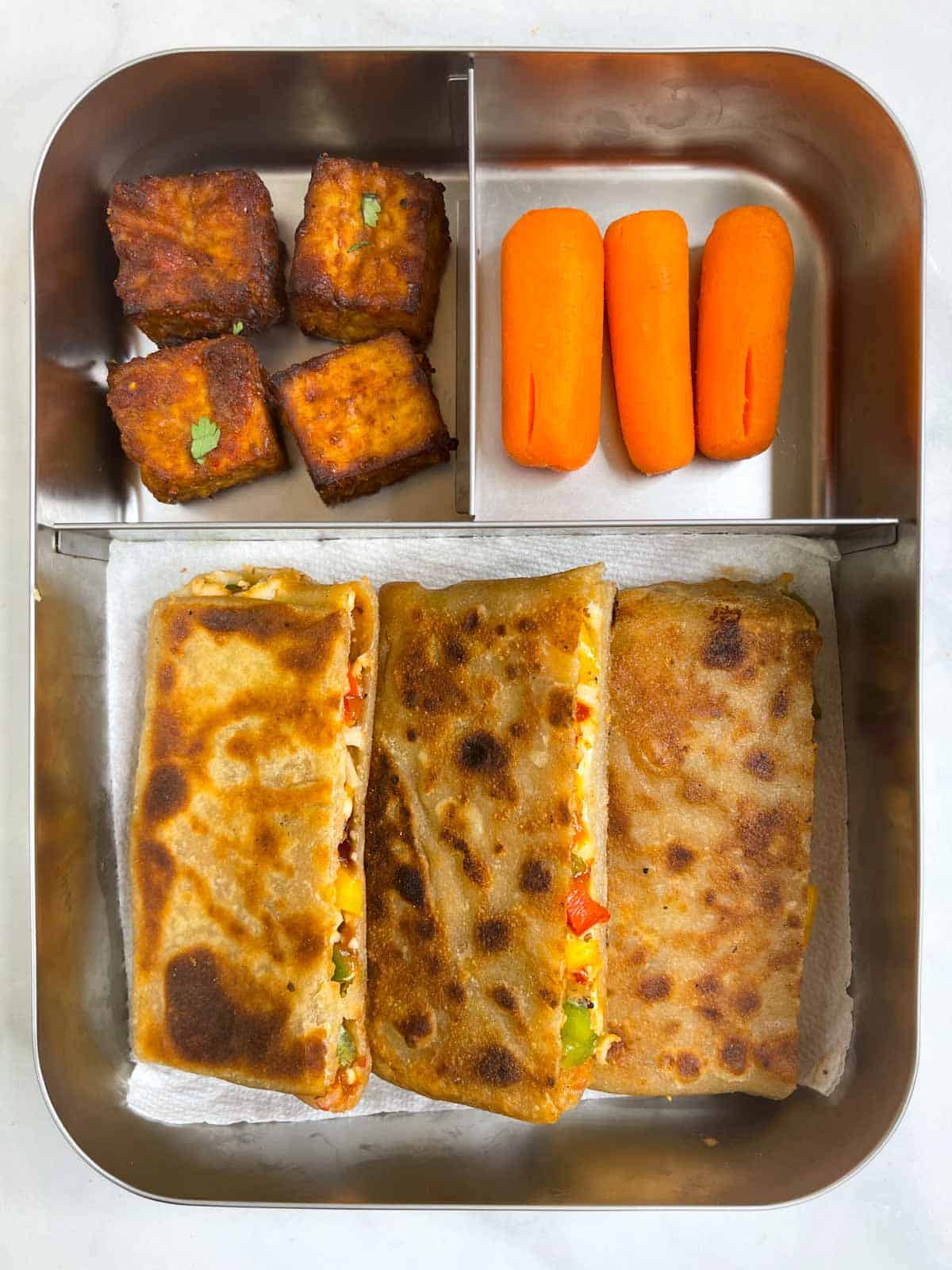 pizza paratha with carrot and crispy tofu in bento steel lunch box