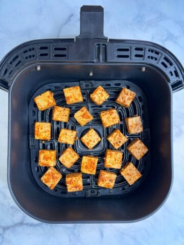 step to air fry tofu in the air fryer basket